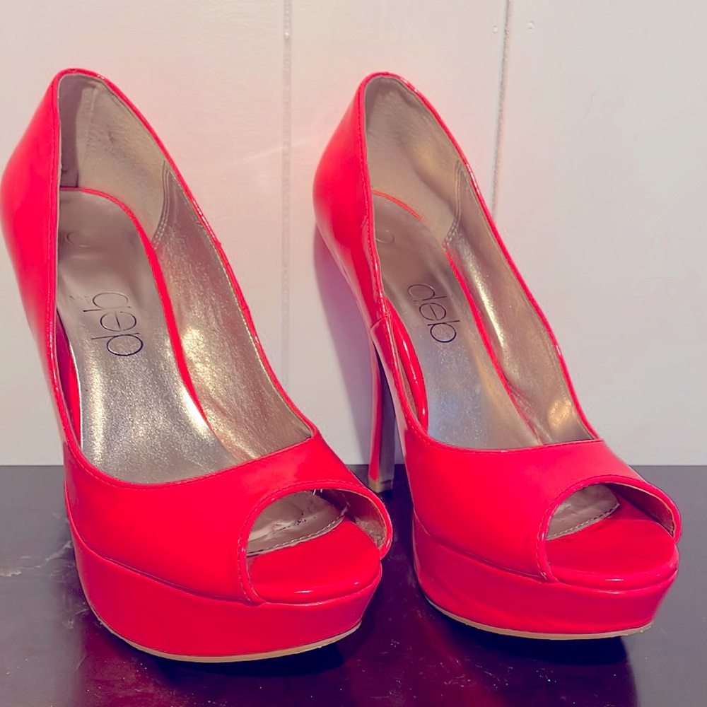 Hot pink, black light reactive, peep toe heels. So much fun!